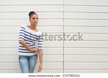 Horizontal portrait of a female fashion model against white background