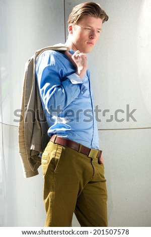 Portrait of an attractive male model posing outdoors