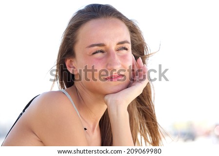 Close up portrait of an attractive young woman thinking outside