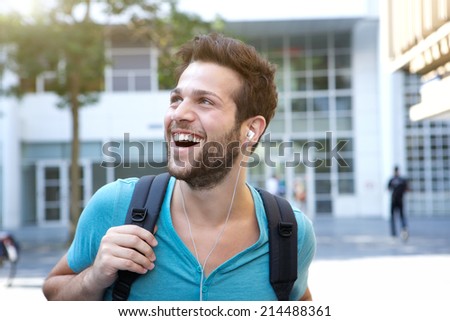 Close up portrait of a male college student walking on campus
