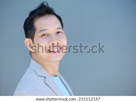 Close up portrait of an older chinese man smiling