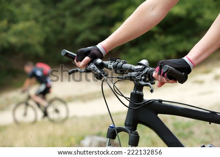 Close up woman hands on bicycle handle bars