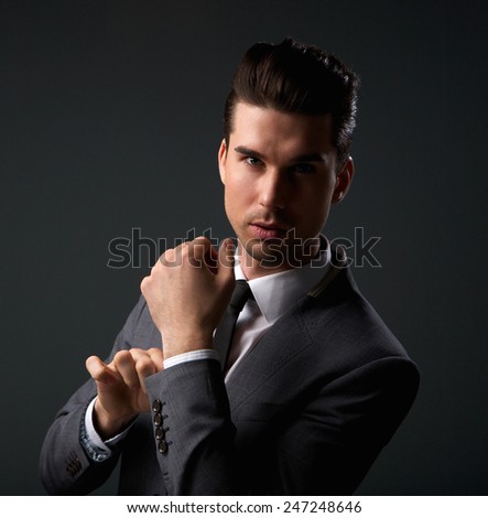 Close up portrait of a cool young guy in modern business suit