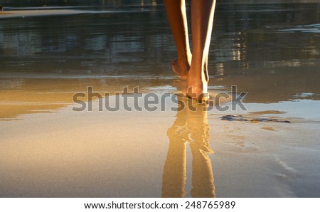 Close up low angle african american woman walking on beach