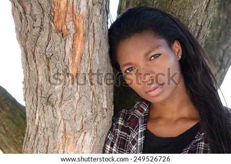 Close up portrait of an attractive young black woman with long hair