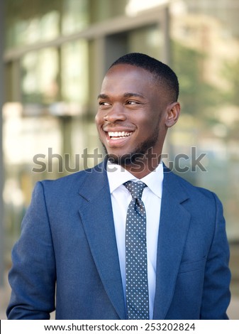 Close up portrait of a confident businessman smiling in the city