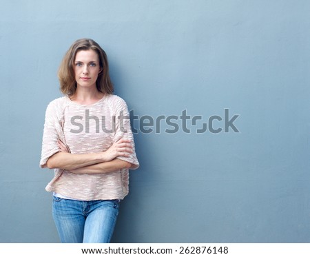 Portrait of a confident mid adult woman posing with arms crossed