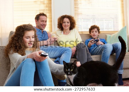 Portrait of a happy family with house pet relaxing at home