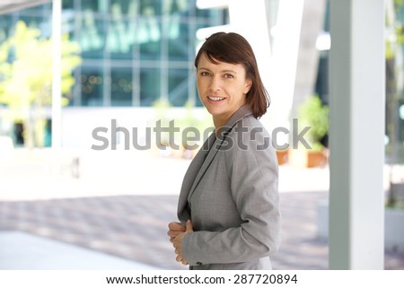 Close up portrait of an older business woman smiling outdoors