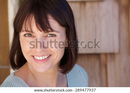 Close up portrait of a beautiful older woman smiling
