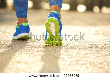 Low angle close up female running shoes outside
