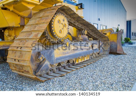 bulldozer driver is caught on the gravel