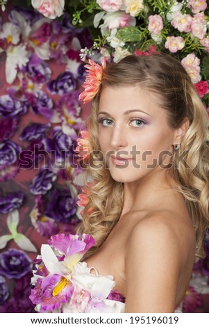 Flower Fairy. Portrait of a beautiful girl with a flower in her hair