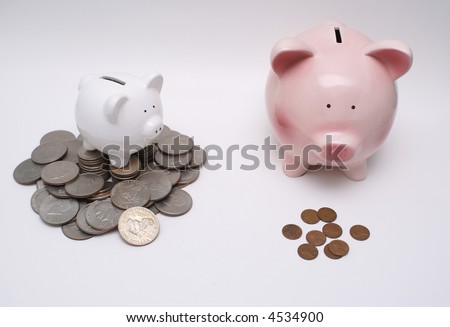 Small piggy bank on pile of money and big piggy bank with small change