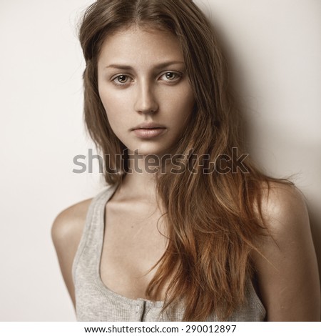 Beauty portrait of young sexy model with long straight hair.