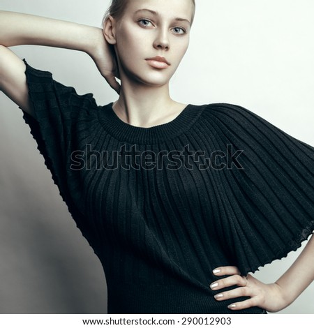 Fashion portrait of young beautiful blonde model with straight hair. Professional nude makeup.
