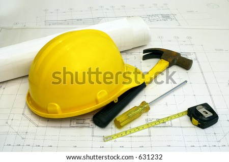 Architectural Floor Plans and Some Builders\' Tools - a hammer, screwdriver & measuring tape