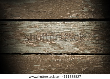 Old skinning paint background in sepia tone and dark corners