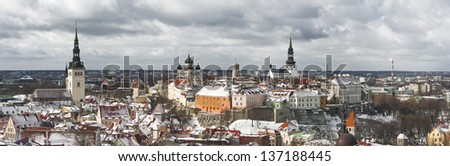 Historic Old Town of Tallinn, capital of Estonia. Roofs of houses are covered with snow.