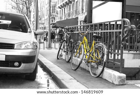 Classic yellow bicycle on black and white photo in Paris, France