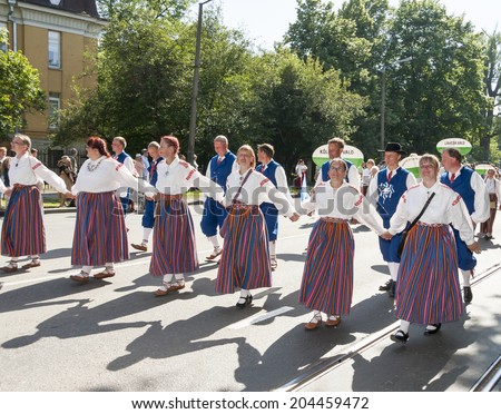 TALLINN, ESTONIA- JULY 05, 2014: Parade of the Estonian XXVI National song and dance festival called Aja Puudutus, Puudutuse Aeg in Tallinn, Estonia on July 05, 2014