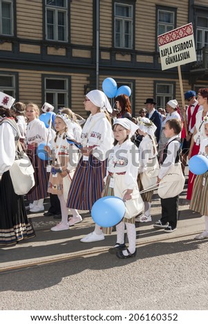 TALLINN, ESTONIA - JULY 05, 2014: Parade of the Estonian XXVI National song and dance festival called Aja Puudutus, Puudutuse Aeg in Tallinn, Estonia on July 05, 2014