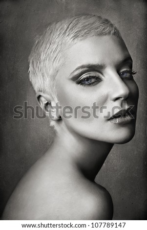 portrait of blond blue eyes with pixie haircut