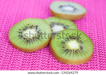 Kiwi fruit,almond,dried beans and nut  on pink background