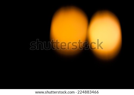 Defocus of candle light in the dark background