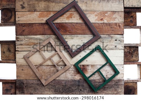 Empty wooden frame for photographer or painting hang on wooden hall
