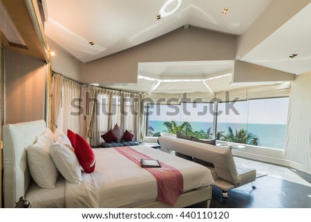 Modern style of living room with bed and sea view in resort ,Thailand