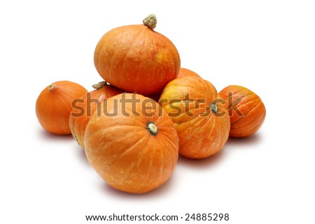 Stack of Golden Nugget pumpkins (Squash) on white with clipping path
