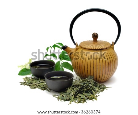 Chinese Long Jing green tea with small pot and cups isolated on white - stock photo