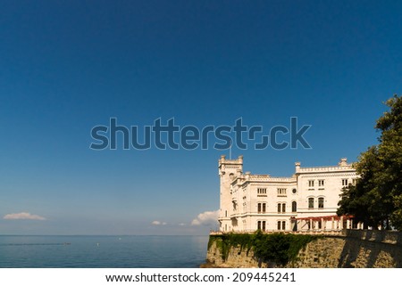 Morning view of Castle Miramare nearby Trieste against the blue sky and the blue sea