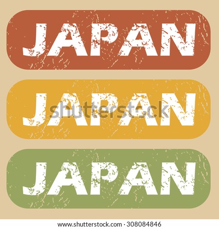 Set of rubber stamps with country name Japan on colored background