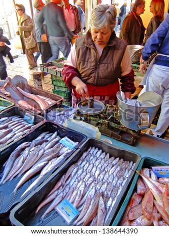 SPLIT, CROATIA - NOVEMBER 4: An unidentified woman sells fish at a local market on November 4, 2010 in Split, Croatia. Croatia with its hundreds of islands is a unique area for variety of fishes.