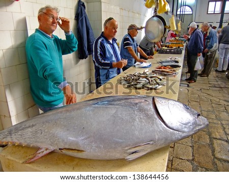 SPLIT, CROATIA - NOVEMBER 4: Unidentified men sell fish at a local market on November 4, 2010 in Split, Croatia. Croatia with its hundreds of islands is a unique area for variety of fishes.