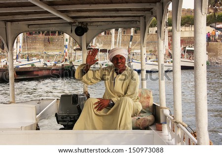 LUXOR, EGYPT - DECEMBER 23: An unidentified man drives his boat on the Nile river on December 23, 2010 in Luxor, Egypt. Nile river is generally regarded as the longest river in the world.