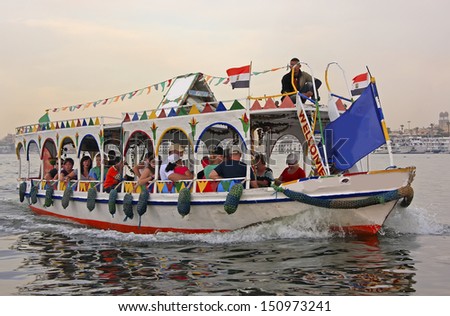 LUXOR, EGYPT - DECEMBER 23: Unidentified people take river cruise on the Nile river on December 23, 2010 in Luxor, Egypt. Nile river is generally regarded as the longest river in the world.