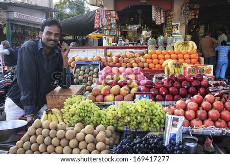 BUNDI, INDIA - FEBRUARY 4: An unidentified man sells fruits at the market on February 4, 2011 in Bundi, India.  Growing fruits contributes a big portion to the overall economic growth in Bundi.
