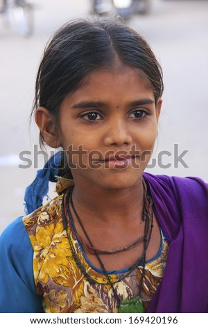 BUNDI, INDIA - FEBRUARY 4: An unidentified girl walks in the street on February 4, 2011 in Bundi, India. Bundi is a popular place of attraction and tourism industry primarily supports its economy.