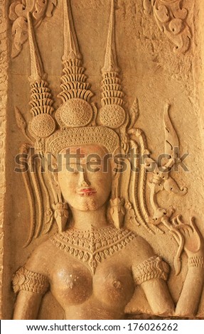 SIEM REAP, CAMBODIA - DECEMBER 21: Wall bas-relief of Devata in Angkor Wat temple on December 21, 2011 in Siem Reap, Cambodia. Angkor Wat is the world\'s largest single religious monument.