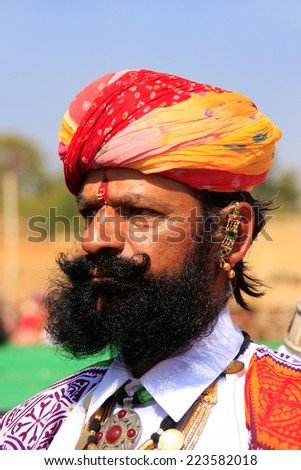 JAISALMER, INDIA - FEBRUARY 16: Unidentified man takes part in Mr Desert competition on February 16, 2011 in Jaisalmer, India. Main purpose of this Festival is to display colorful culture of Rajasthan
