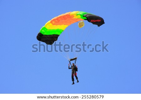 JAISALMER, INDIA -FEBRUARY 17: Unidentified air force soldier skydives during Desert Festival on February 17, 2011 in Jaisalmer, India. Main purpose of this Festival is to display culture of Rajasthan