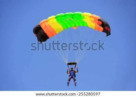 JAISALMER, INDIA -FEBRUARY 17: Unidentified air force soldier skydives during Desert Festival on February 17, 2011 in Jaisalmer, India. Main purpose of this Festival is to display culture of Rajasthan