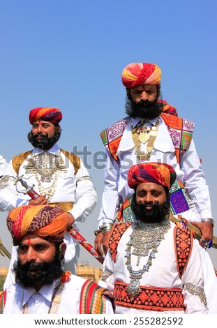 JAISALMER, INDIA - FEBRUARY 16: Unidentified men take part in Mr Desert competition on February 16, 2011 in Jaisalmer, India. Main purpose of this Festival is to display colorful culture of Rajasthan