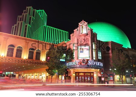 RENO, USA - AUGUST 12: Silver Legacy resort and casino at night with moving lights from passing traffic on August 12, 2014 in Reno, USA.  Reno is the most populous Nevada city outside of the Las Vegas