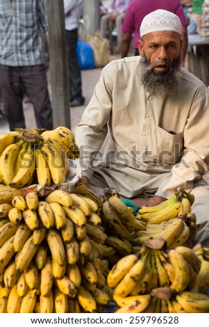 DELHI, INDIA - NOVEMBER 5: Unidentified man sells bananas at Chandni Chowk on November 5, 2014 in Delhi, India. Chandni Chowk is one of the oldest and busiest markets in Old Delhi.