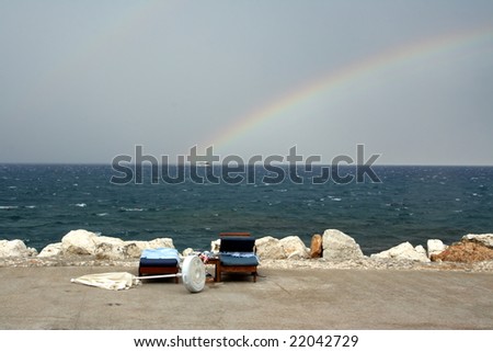 Rainbow on seacoast after a summer thunder-storm