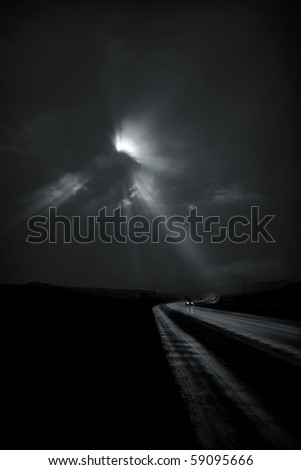 Single car travels on dark road